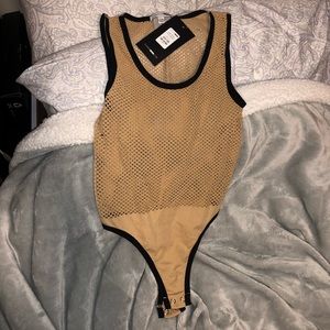 Nude and black mesh body suit